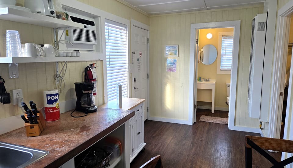 The cottage has window air conditioning units and gas heat