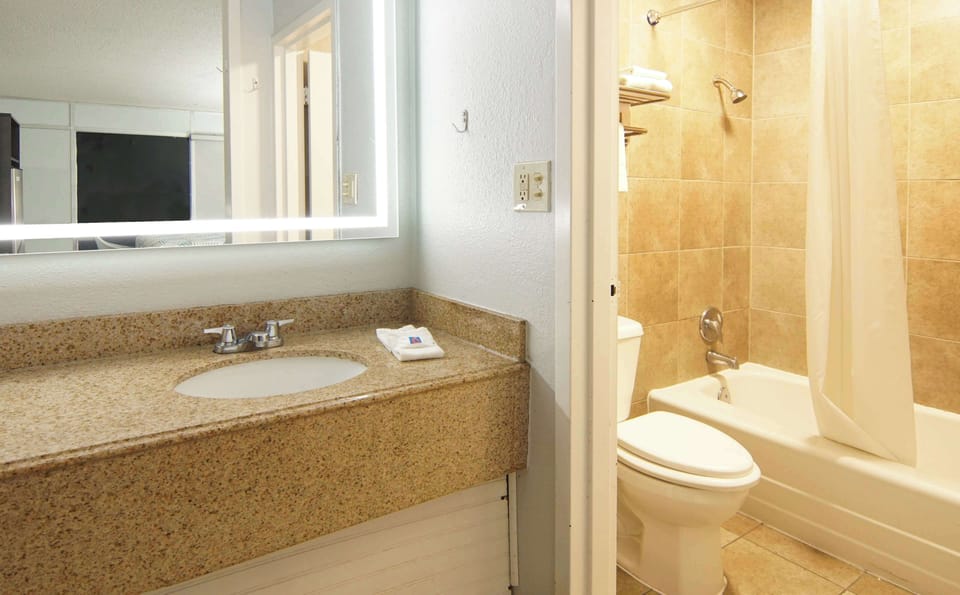 Combined shower/tub, hair dryer, towels, soap