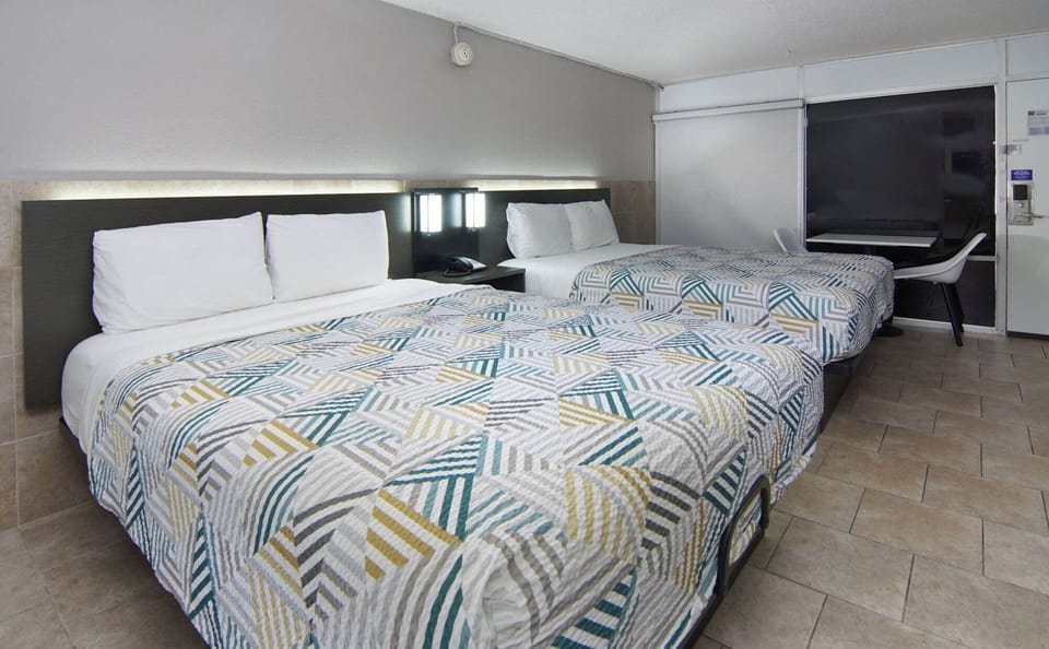 Standard Room, 2 Queen Beds, Non Smoking, Kitchen | Desk, blackout drapes, iron/ironing board, free WiFi