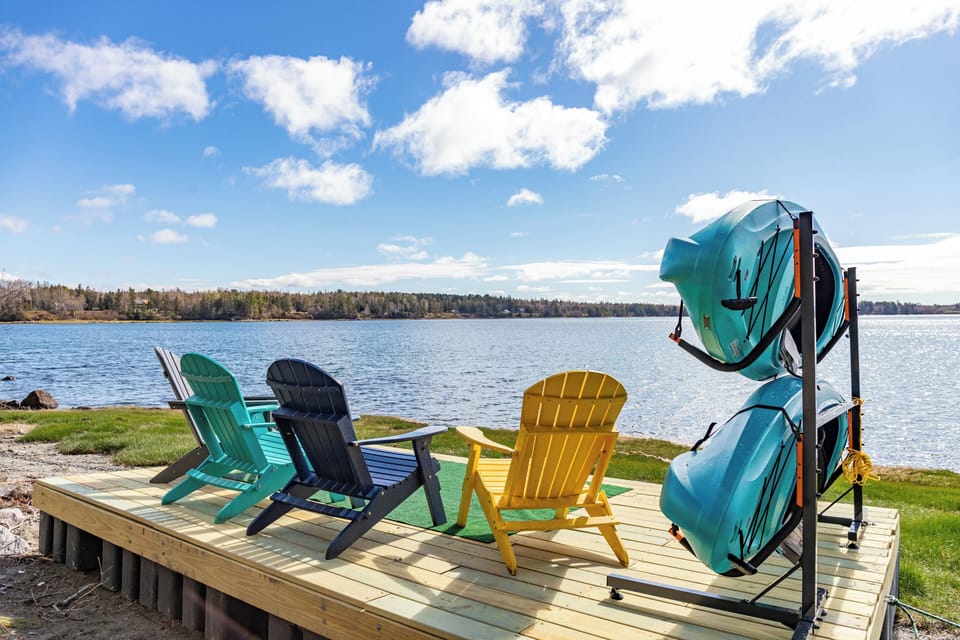 Sitting area by the beach with our complimentary kayaks.
