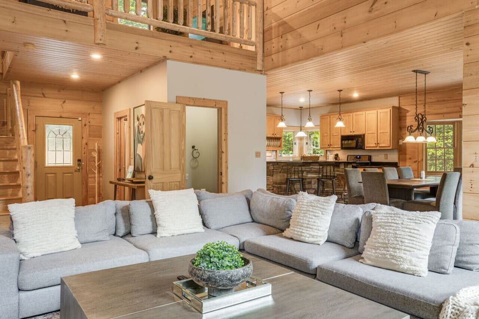 Relax in style by the stone gas fireplace, enjoy your favorite shows on the smart TV, or simply kick back on the spacious couch.