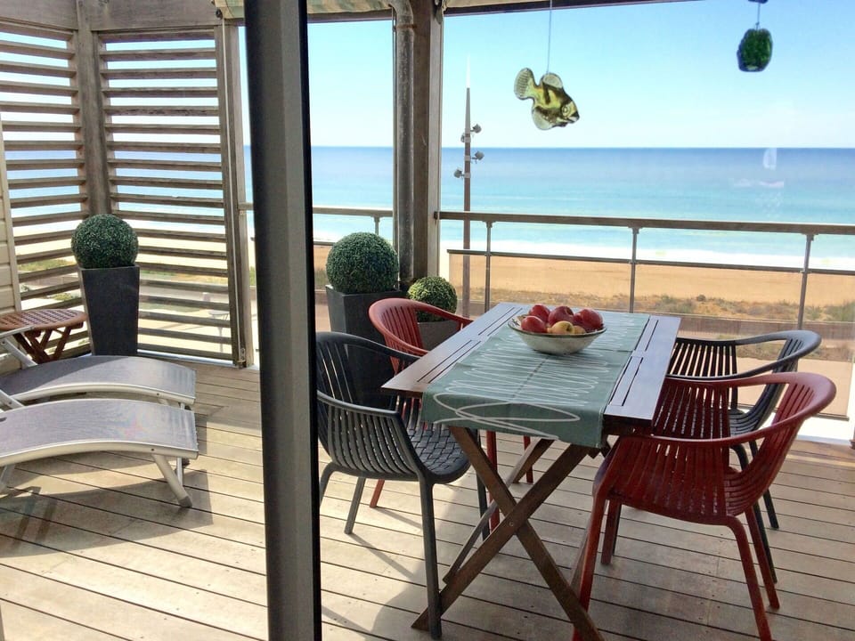 Water, Sky, Furniture, Property, Plant, Table, Azure, Chair, Shade, Building