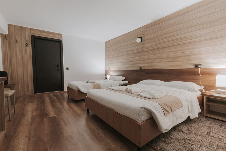 Family Triple Room | Minibar, free WiFi, bed sheets