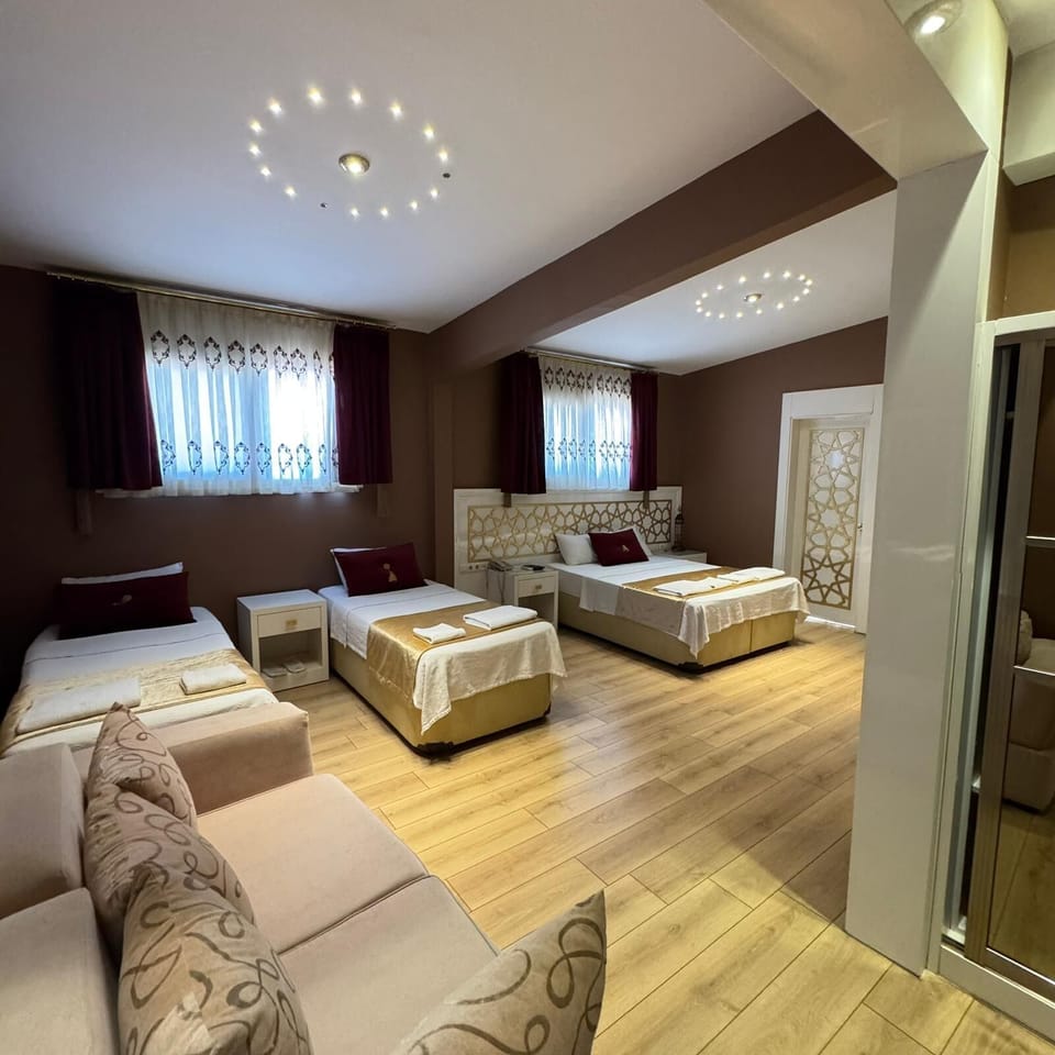 Deluxe Quadruple Room | Premium bedding, free minibar items, desk, laptop workspace