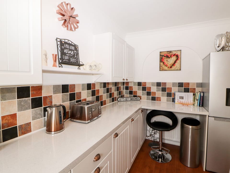 Fridge, electric kettle, toaster, cookware/dishes/utensils