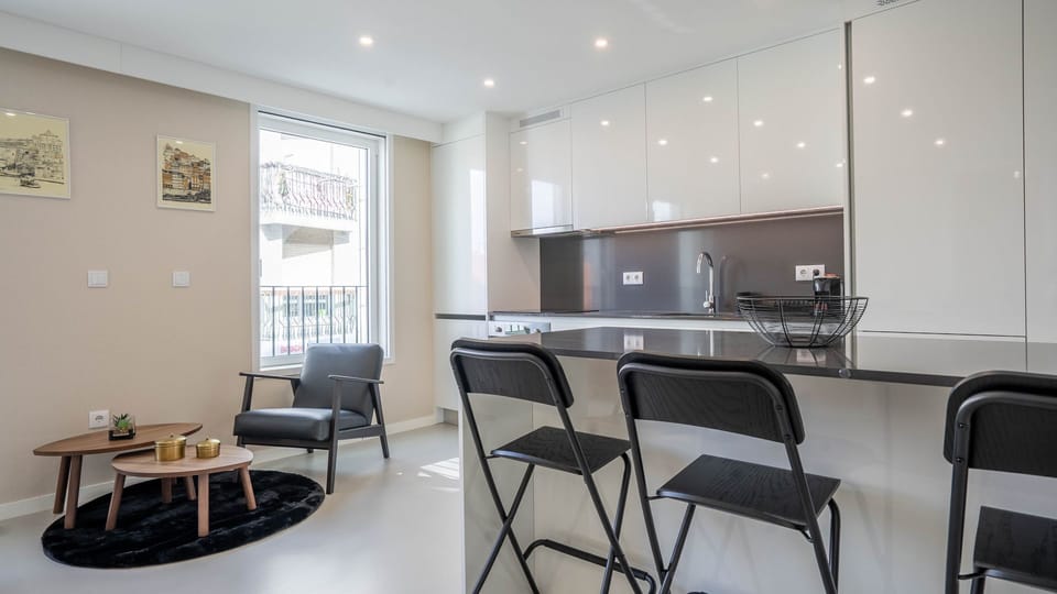 Enjoy morning coffee at the stylish breakfast bar or unwind in the cozy armchair by the window, letting natural light fill your space. The modern design provides a comfortable and inviting atmosphere for relaxation or quick meals.