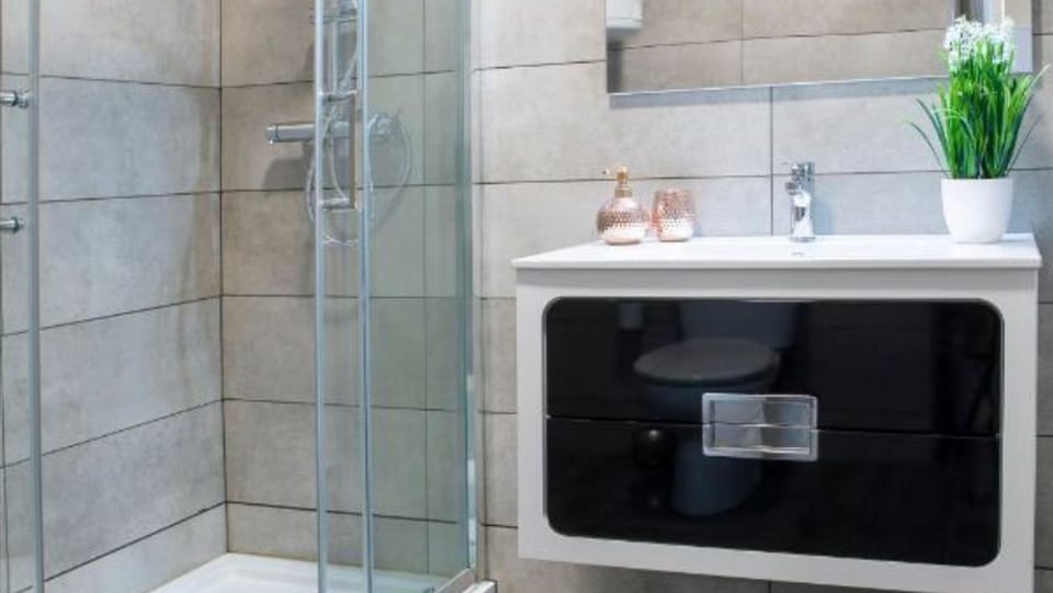 Experience the ultimate in comfort in our well-appointed bathroom, featuring a shower for a relaxing end to your day. #bathroom #shwoer