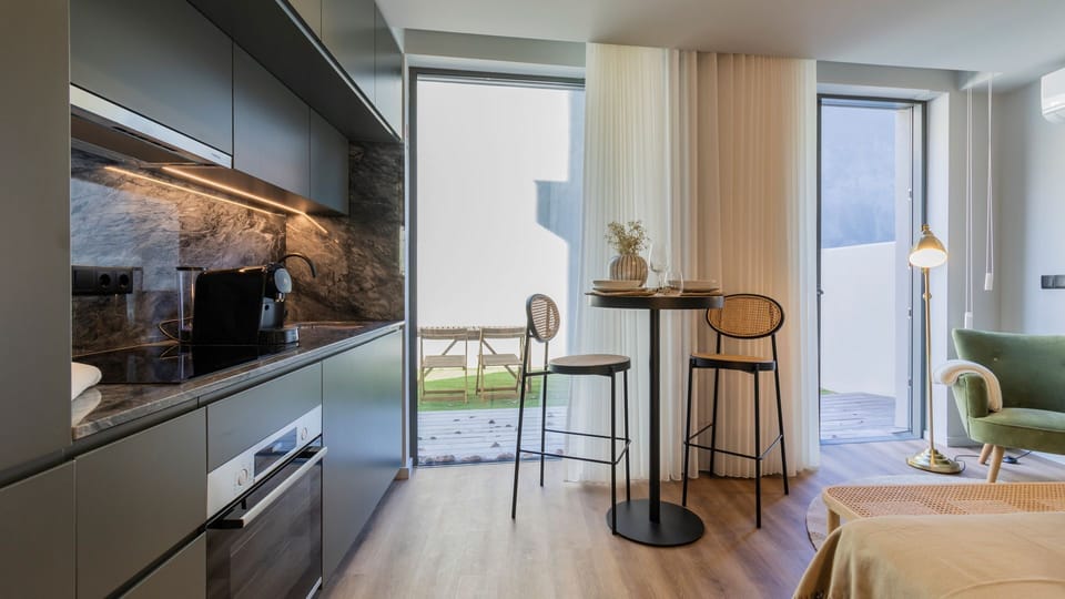Efficiency meets style in our modern dining area and kitchenette space #contemporary #sleek