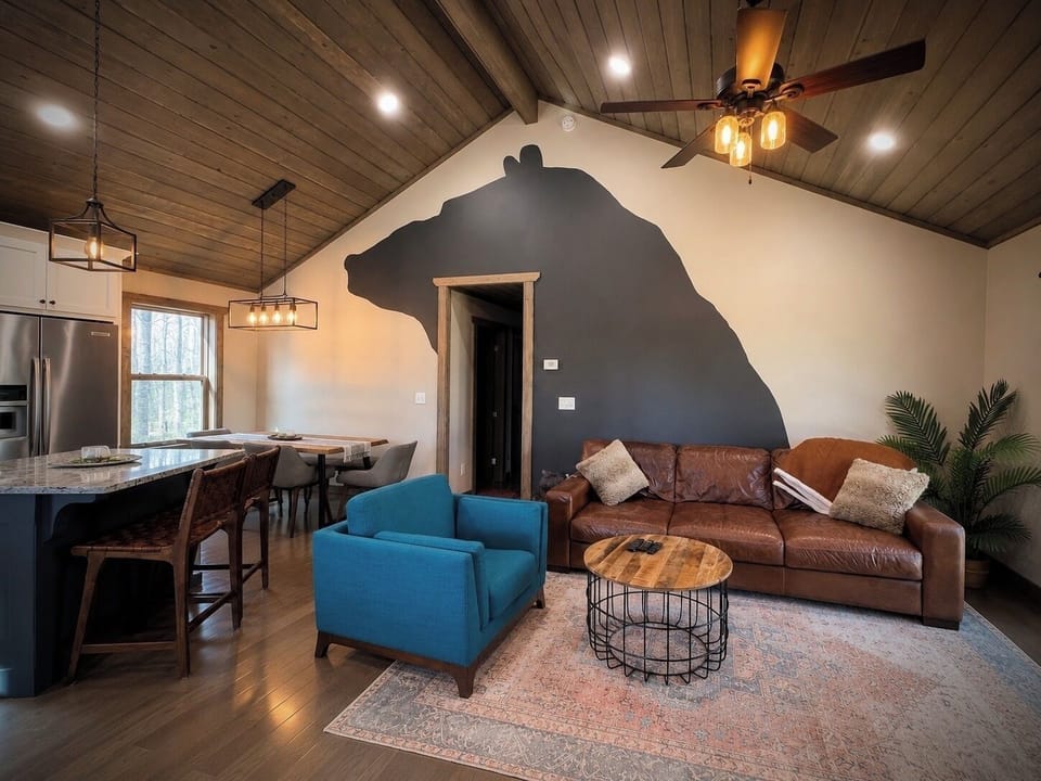 Cozy vaulted great room with rustic charm and bold cabin-inspired style