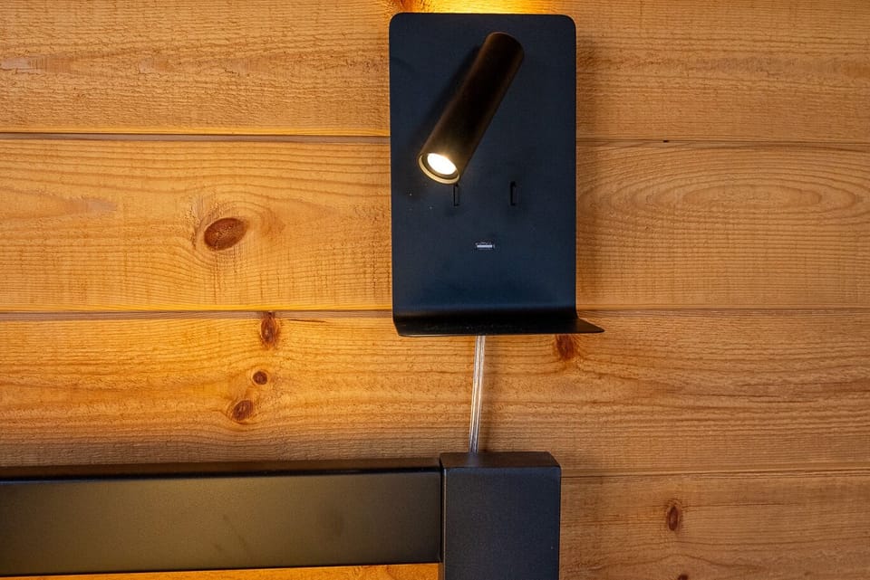 Bedroom 2, main level- reading light, night light, USB port and phone shelf.