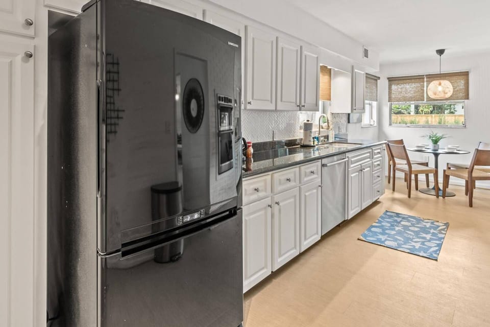 Renovated kitchen with plenty of space to store groceries and supplies for your stay