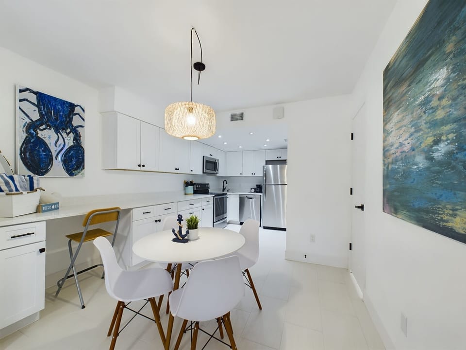 Quartz countertops, stainless steel appliances, cool tile