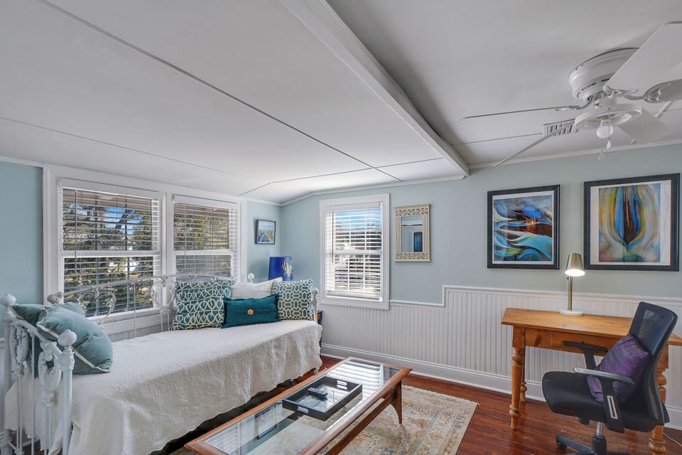 Upstairs Bonus Room with Daybed and Desk - Bonus room includes a twin daybed, writing desk, TV, windows, and a connection to the adjacent daybed den.