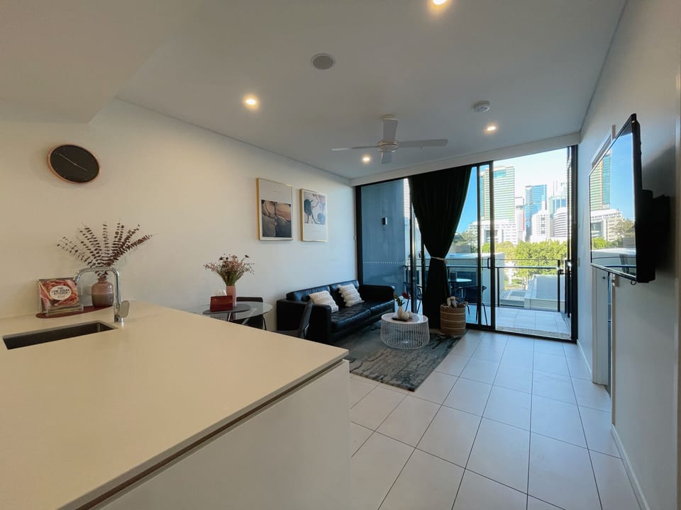 Apartment | Living area | 50-inch Smart TV with digital channels, streaming services