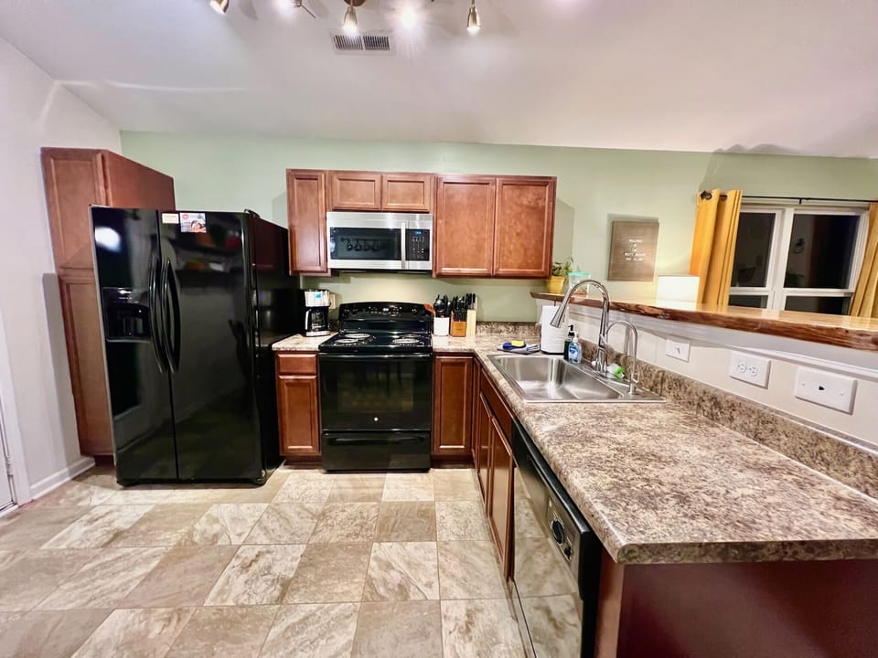 Open concept kitchen with new appliances.