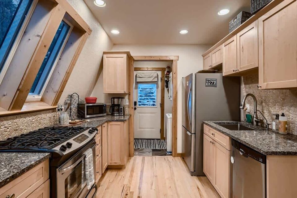 Expansive kitchen seamlessly open to the living room, creating a welcoming and interactive environment. This open-concept design enhances connectivity and flow, perfect for entertaining and family gatherings.
