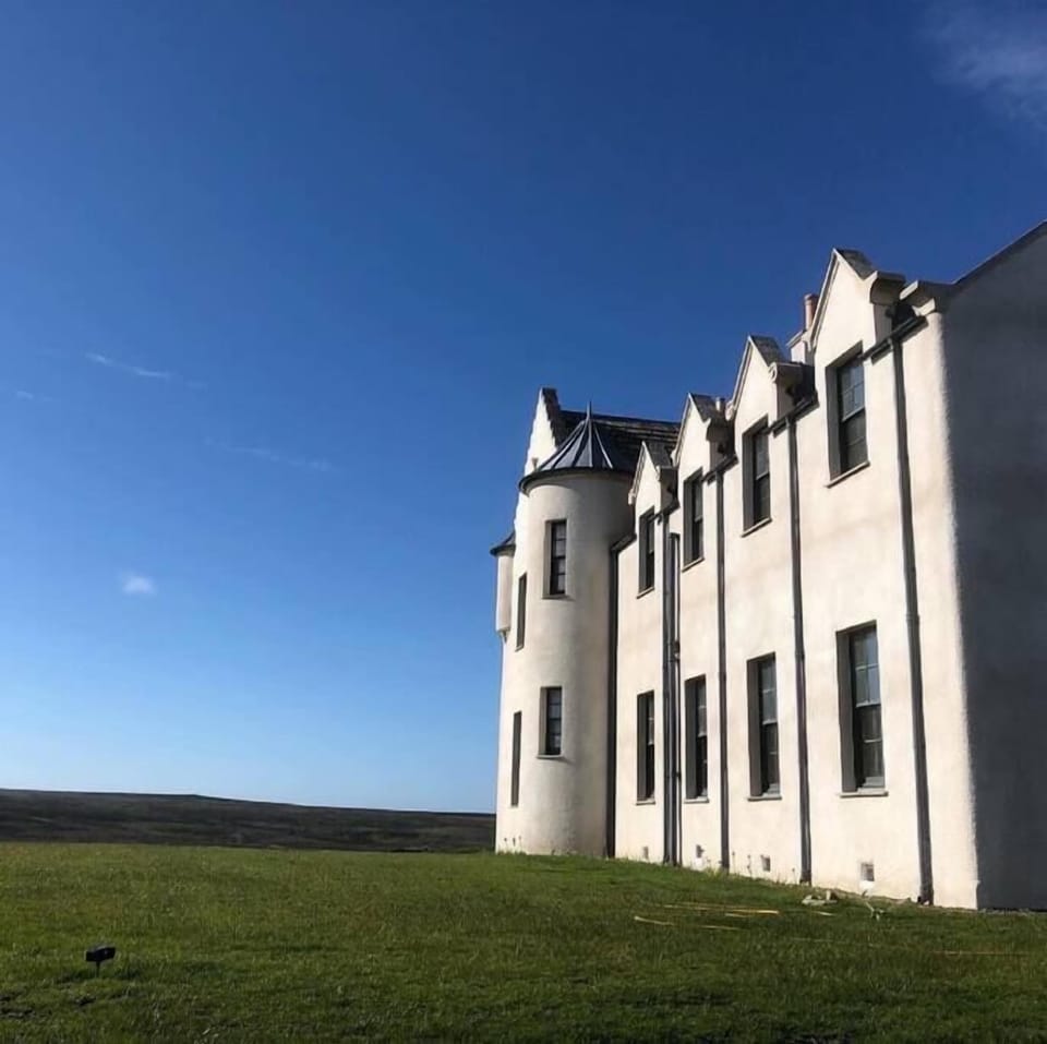 The house faces west across Dunnet Bay to Thurso and out to the Atlantic