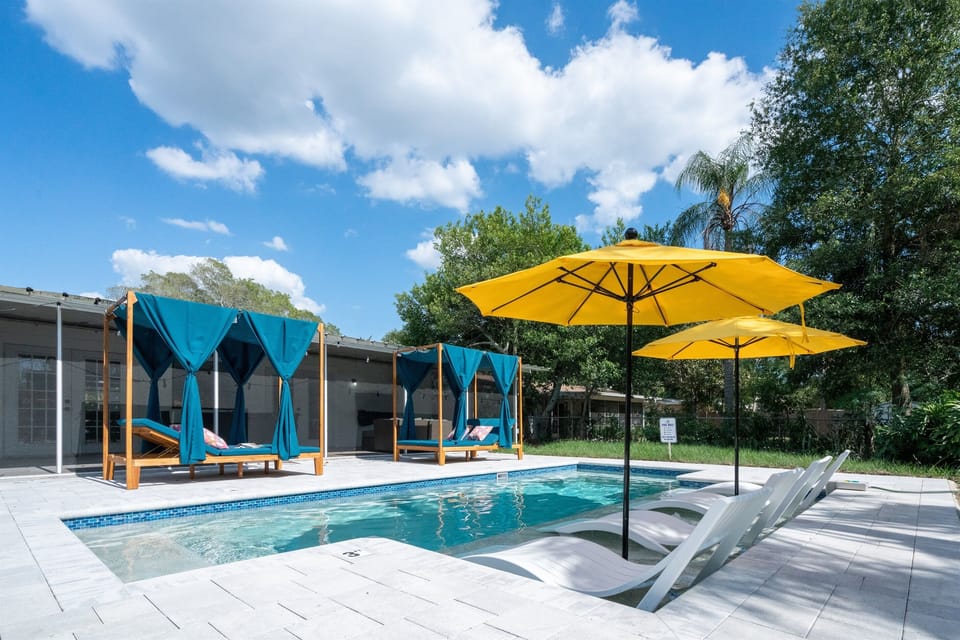 Enjoy resort-style living with a gorgeous heated saltwater pool. Cabanas and sun loungers provide plenty of seating options.