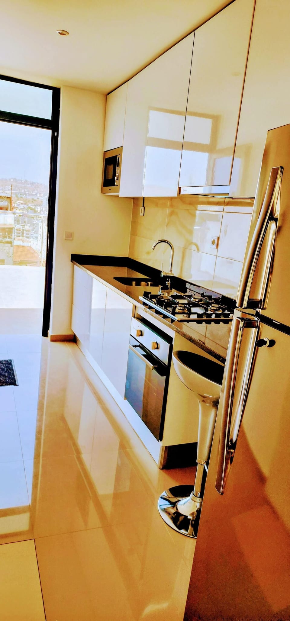 Full kitchen with gas stove & oven, refrigerator, pots, pans, dinnerware, washer