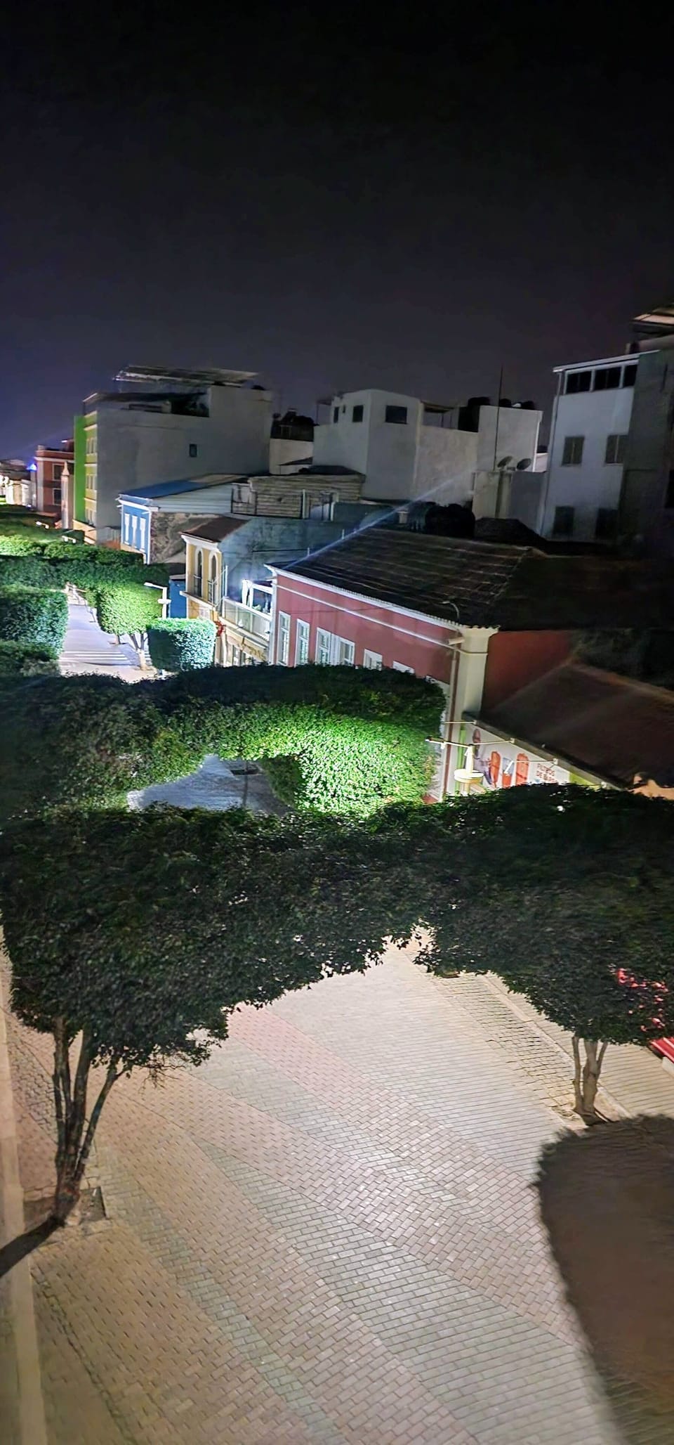 Nighttime city view from private balcony
