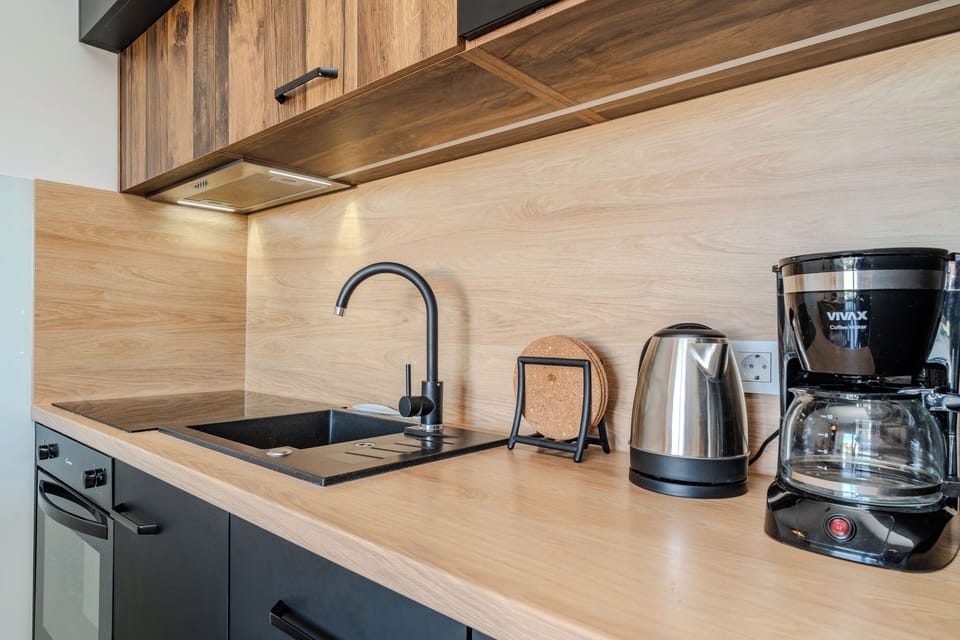 Design Apartment | Private kitchen | Full-size fridge, microwave, oven, stovetop