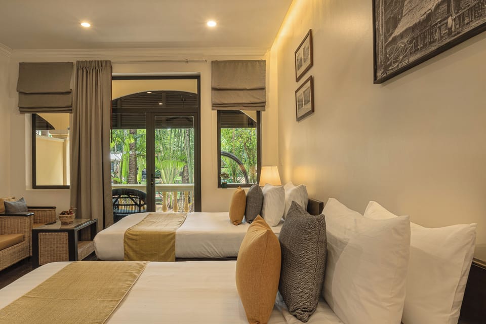 Deluxe Twin with Pool View | Minibar, in-room safe, desk, blackout drapes