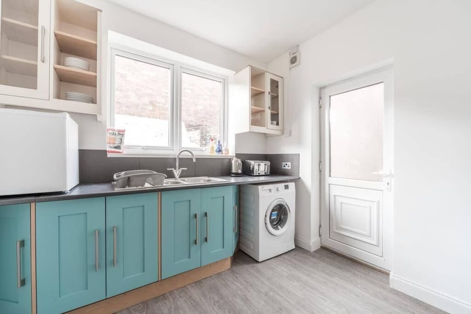 Well-equipped kitchen with all the essentials, including a convenient washer for added comfort and ease.