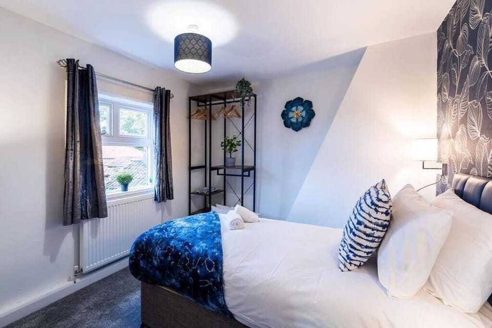 Bedroom with feature wallpaper