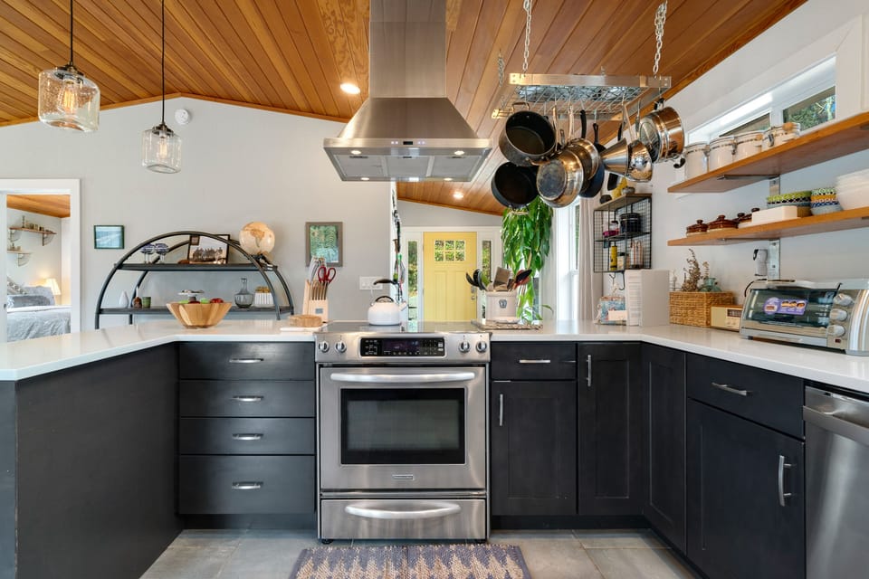 Open Floor plan with Fully equipped Kitchen, Dining table for 6 plus Bar seating. Open to the Living room with Streaming TV, Gas Fireplace, Access to upper deck.
