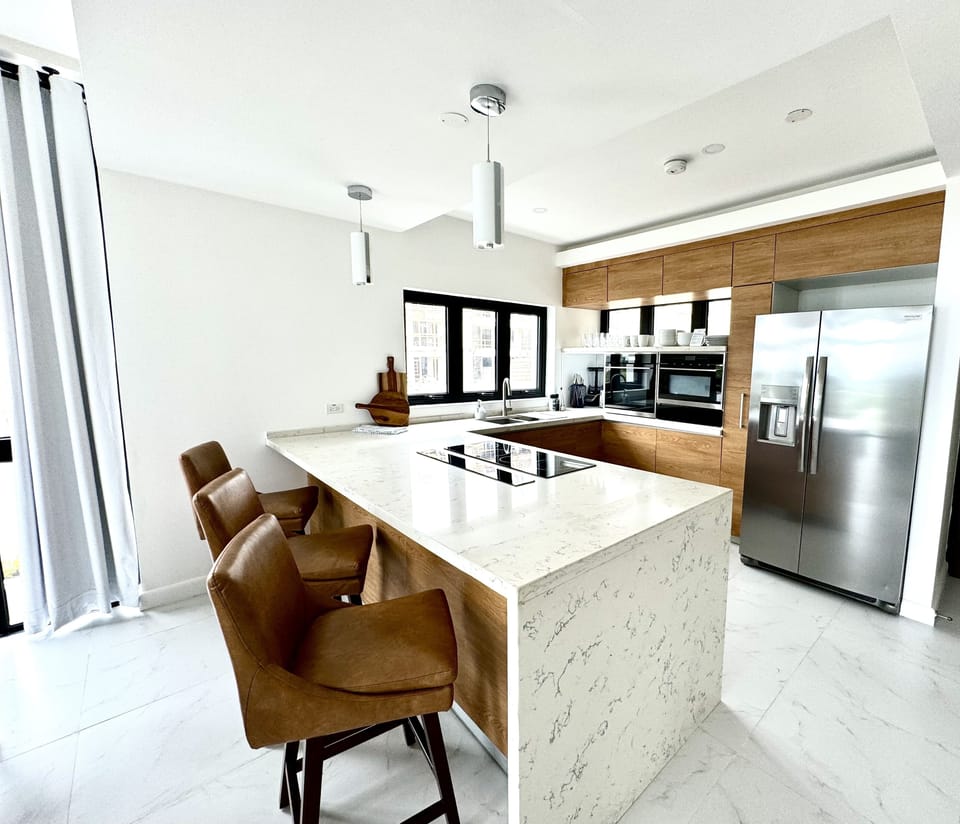 Kitchen with rainfall quartz countertop