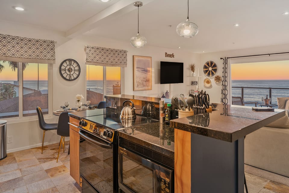 Open plan kitchen and living room overlooking the ocean