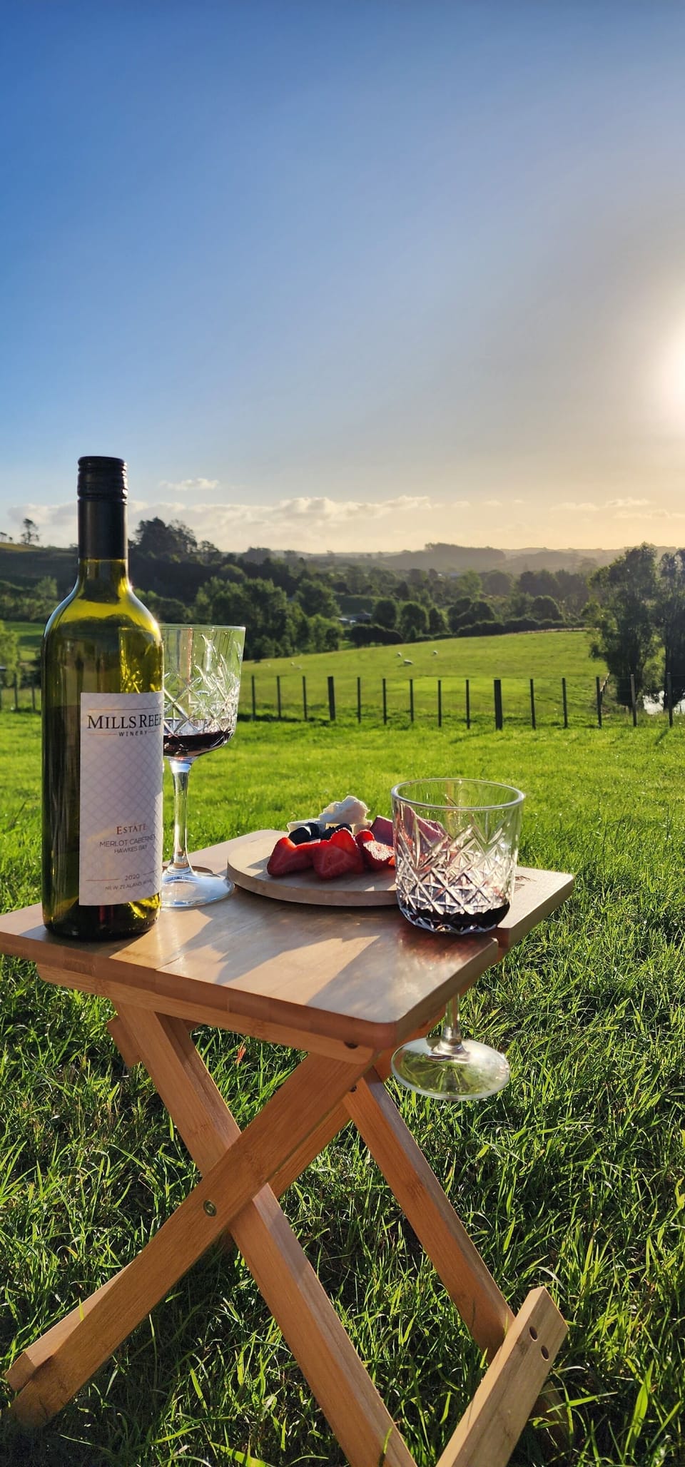 Romantic Sunset Picnic. Wine and cheese platter 