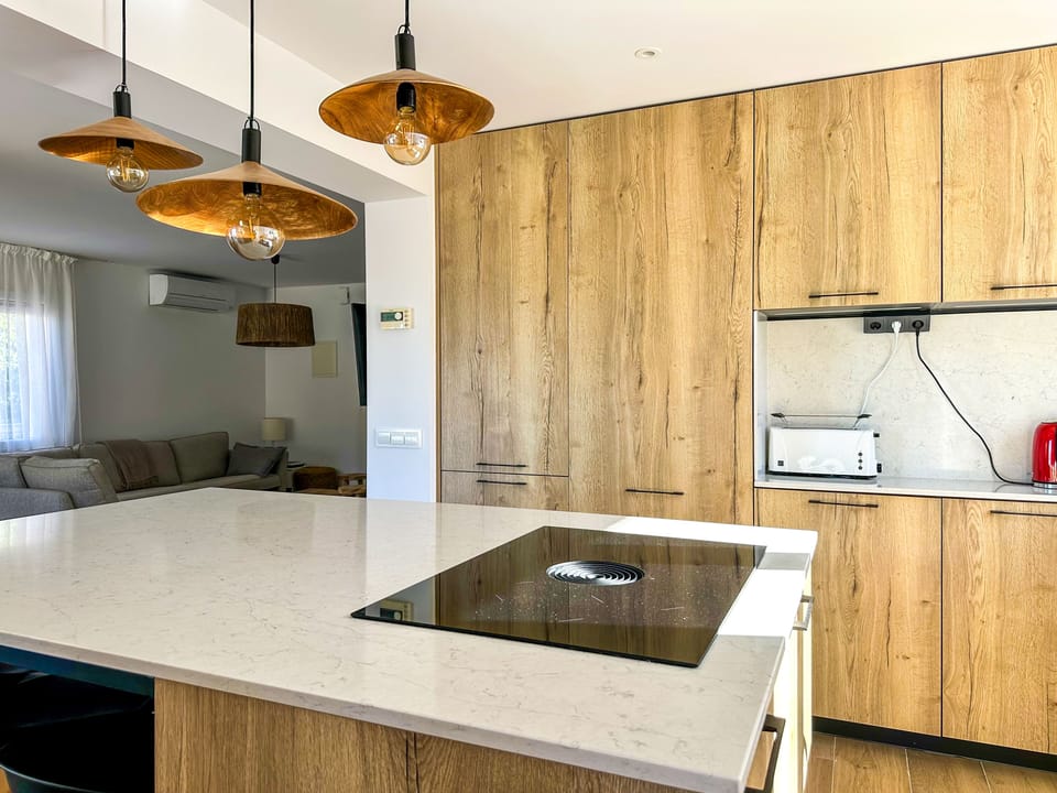 Kitchen next to leaving room