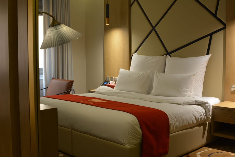 Classic Double Room | Minibar, in-room safe, desk, laptop workspace