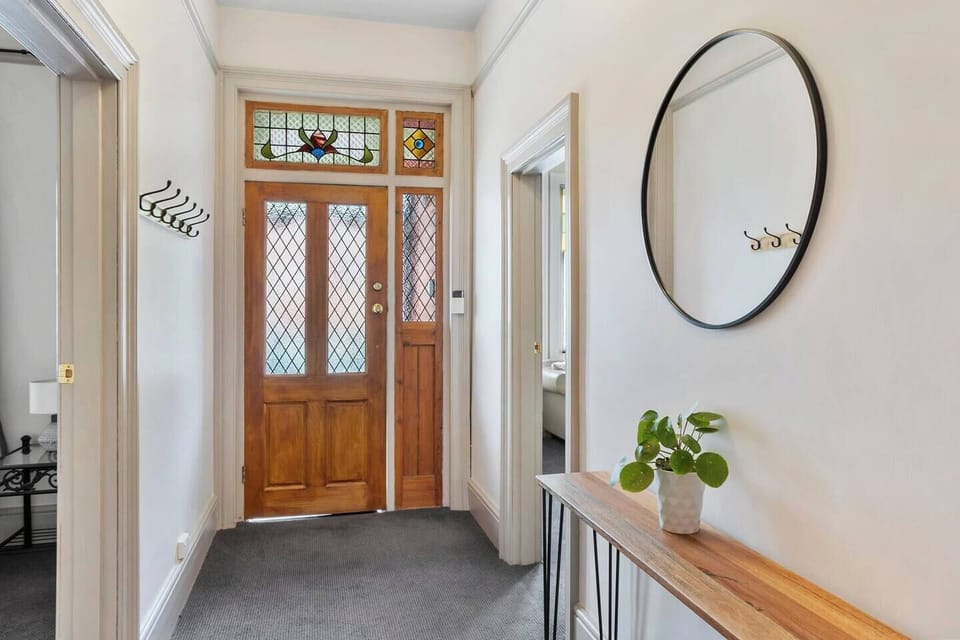 Feel instantly welcomed by the inviting entryway. The blend of period detailing and modern comforts ensures a warm and stylish entrance for all guests.