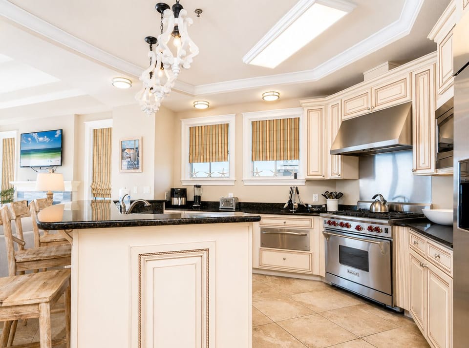 Picture yourself cooking gourmet meals in this chef's dream kitchen, complete with granite countertops, stainless steel appliances, and an elegant island—perfect for morning coffee or evening wine.