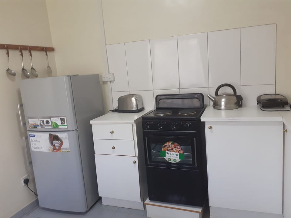 fitted kitchen  with appliances 