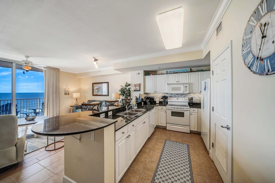 The fully equipped kitchen features granite countertops and has everything you need to cook meals for family & friends.