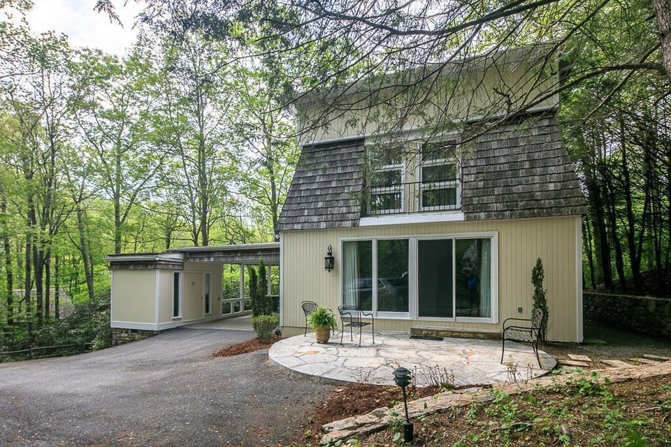 View of the back patio and covered carport where you enter the home.