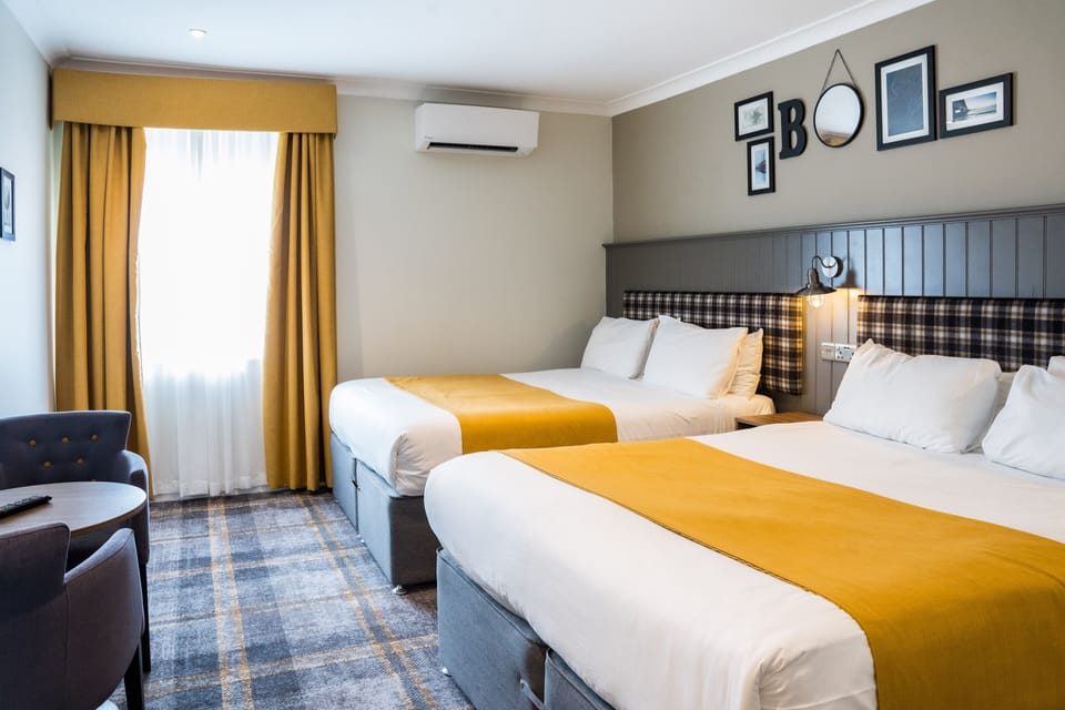 Premium Quadruple Room | Blackout drapes, iron/ironing board, WiFi (free), bed sheets