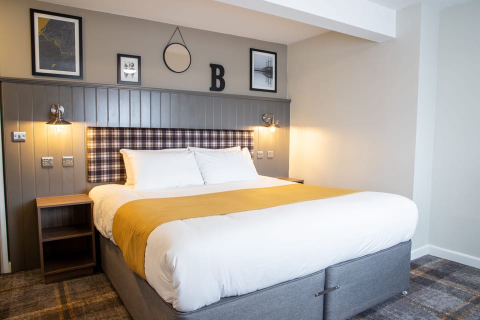 Standard Double Room | Blackout drapes, iron/ironing board, WiFi (free), bed sheets