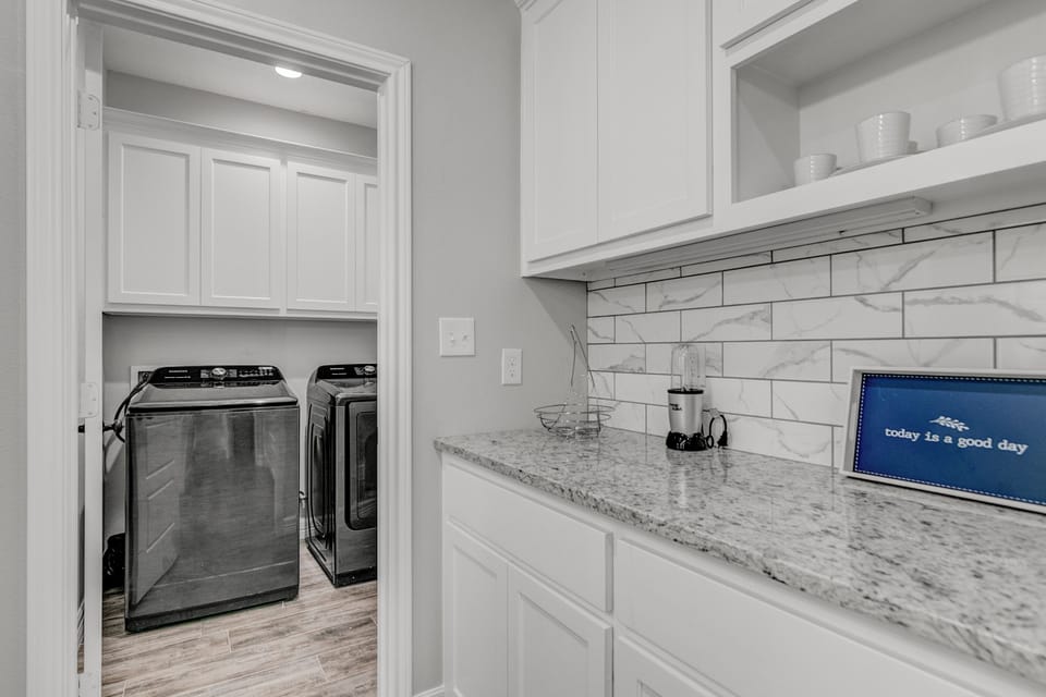 A clean and efficient laundry area for all your washing needs. 🧺✨