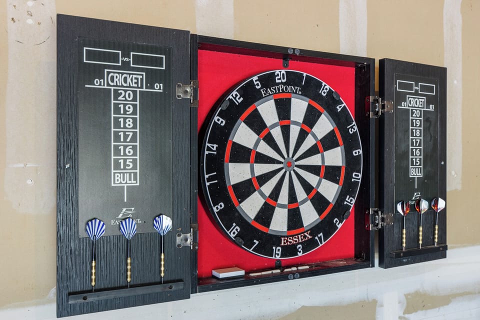 Participate in a dart board competition. Steel tip darts.