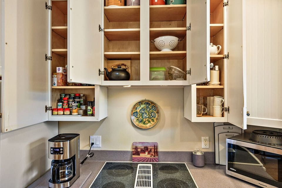 Drip coffee pot, spices, teapot, and miscellaneous kitchen items