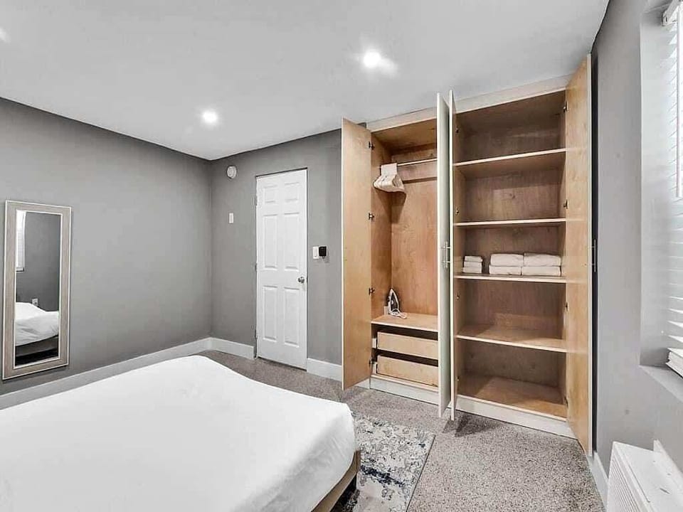 Bedroom with built-in closet and storage shelves