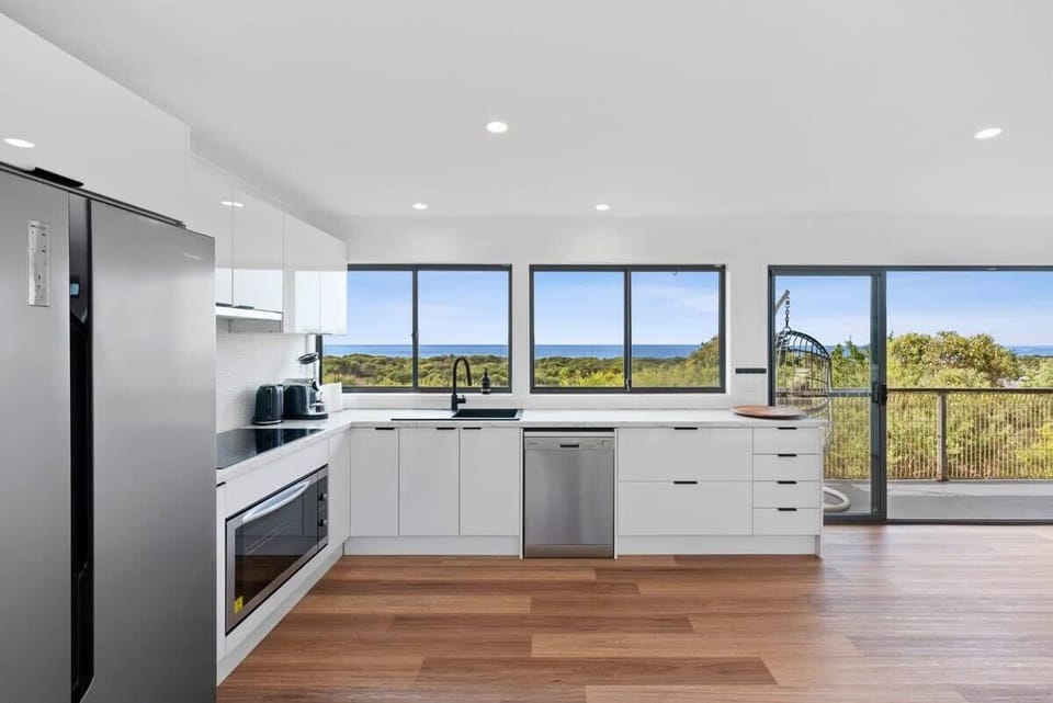 A well-equipped kitchen with priceless sea views