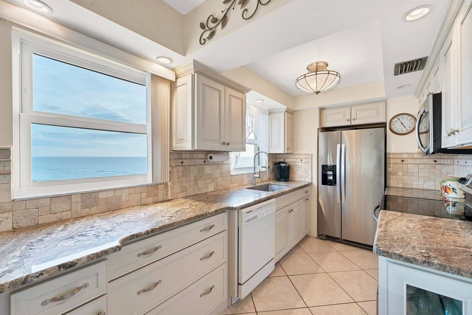 Granite kitchen with stainless steel appliances, pots, pans, dishes included along with million dollar views!