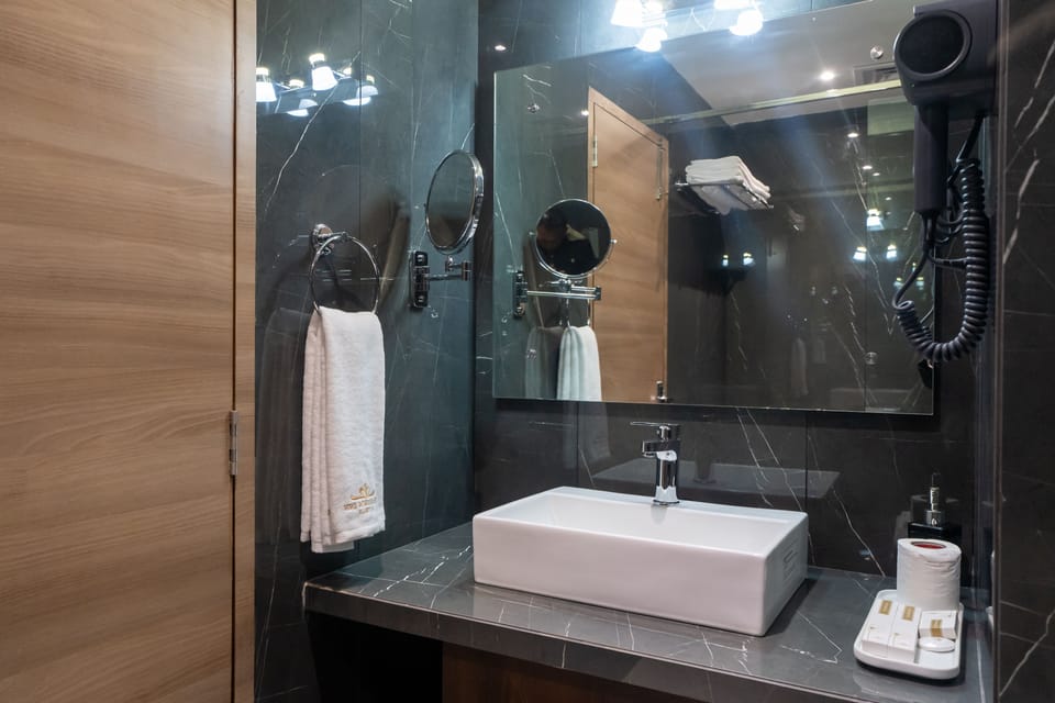 Separate tub and shower, rainfall showerhead, free toiletries, bathrobes