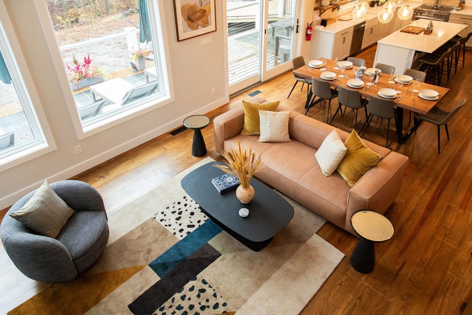 A seamless flow between living space, dining area, and kitchen. 