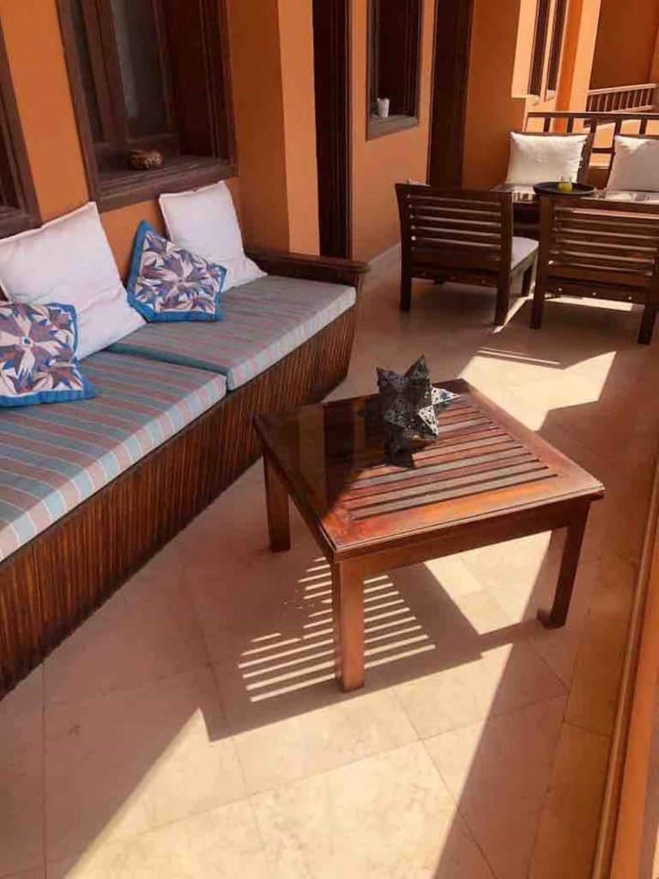 Balcony space with coffee table and seating